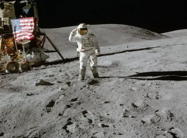 Apollo16 astronaut Charlie M. Duke next to the Orion LM